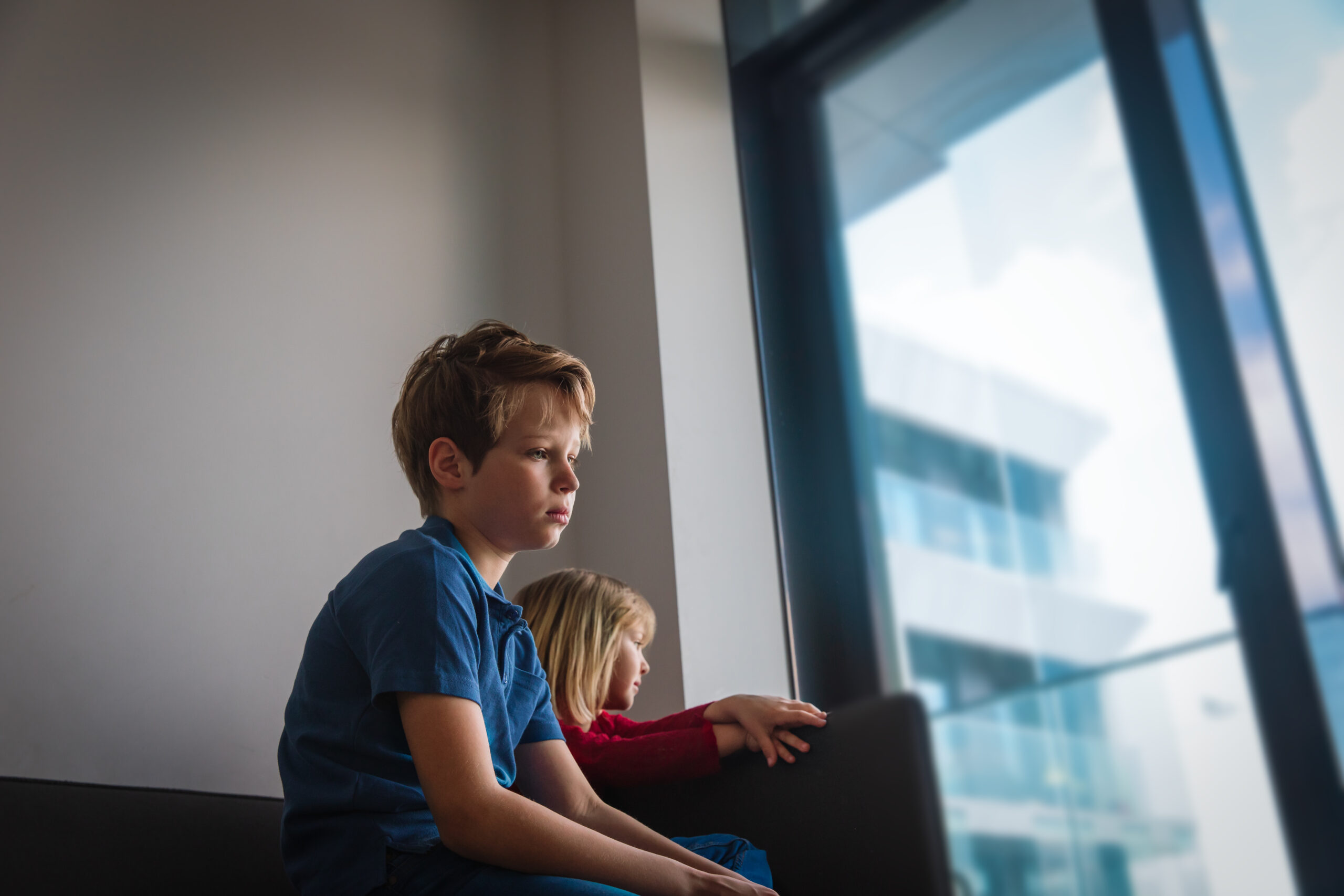 sad boy and girl stay home, family on quarantine, social distancing for kids, mental issues of isolation